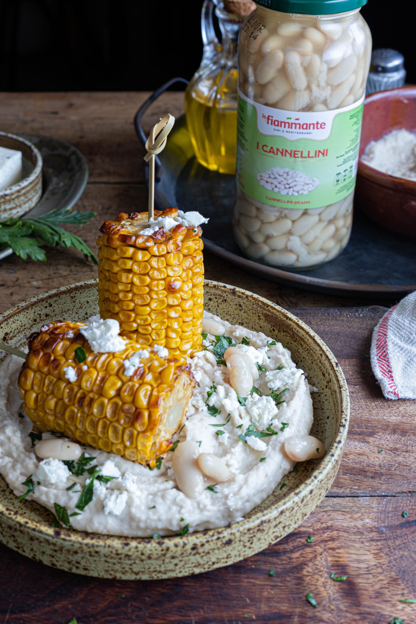 Pannocchie arrosto su crema di feta e cannellini